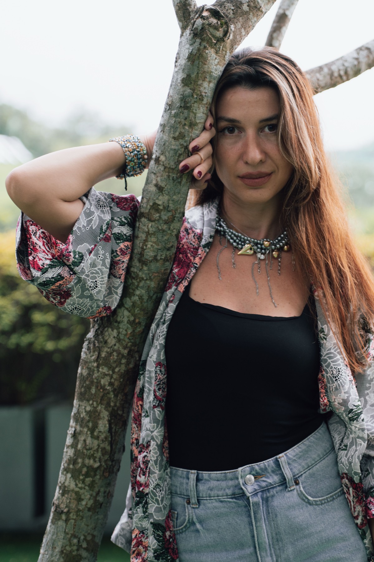 Portrait of a woman by a tree